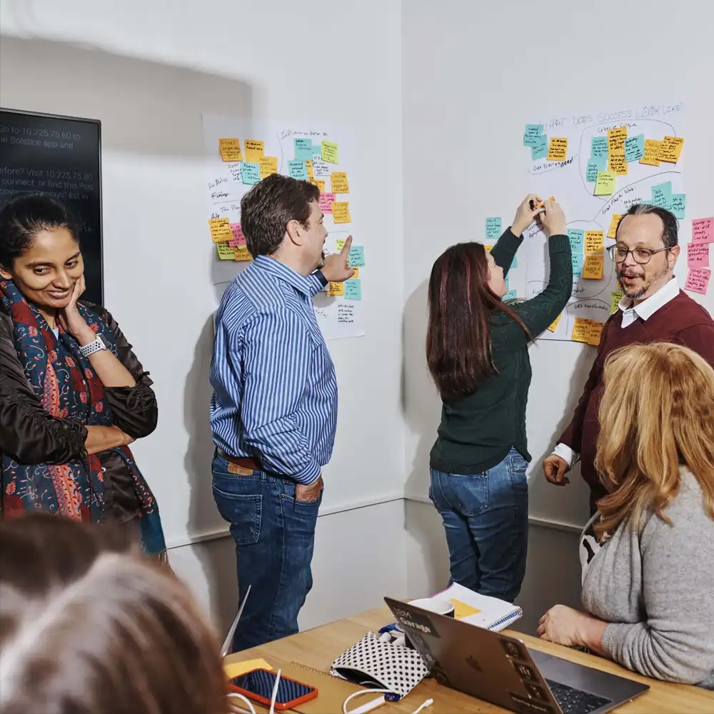 Coworkers brainstorm together in conference room