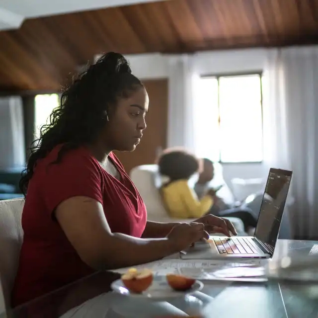 Woman works on laptop